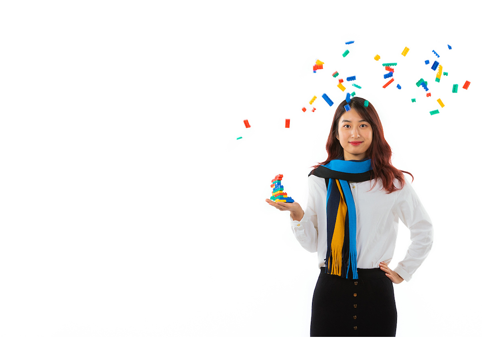 Global Excellence Scholarship student Xinyi from China throws lego in the air